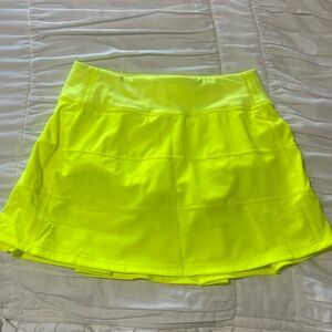 Lululemon women’s size 2 neon yellow, Pace rival MR skirt, long,built in shorts.